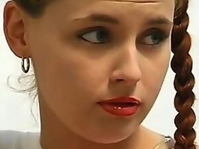 Vintage babe with long pigtails poses for XXX